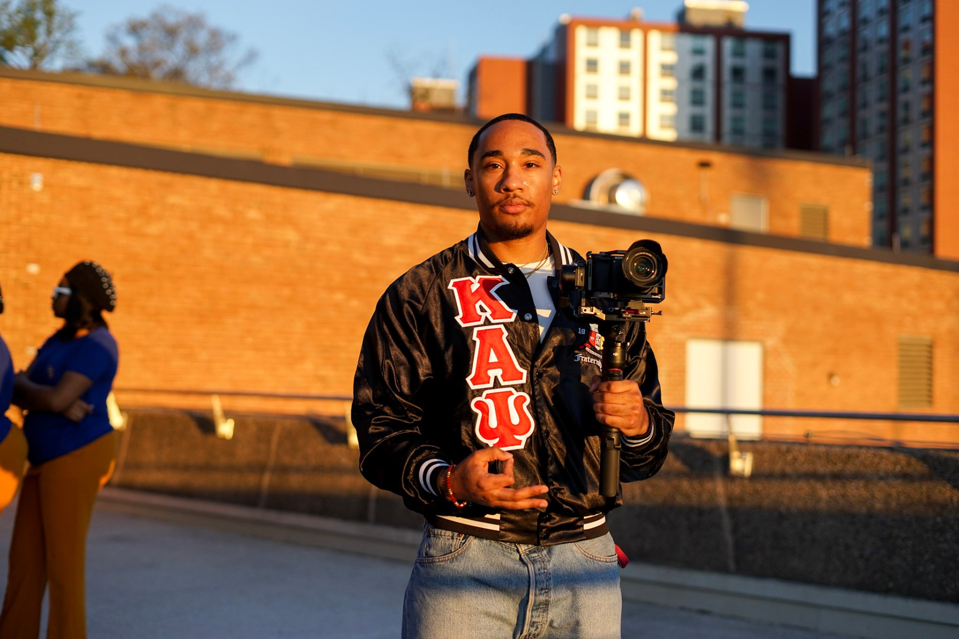 Aaron Hampton holding a camera